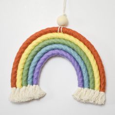 a rainbow decoration hanging on a wall