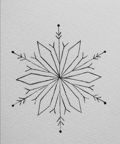 an ink drawing of a snowflake on white paper with black lines and dots