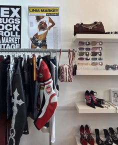 there are many shoes and bags on the shelves