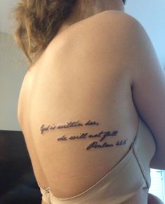 the back of a woman's shoulder with an inscription on it that says, you are