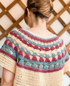 a woman wearing a crochet top with an open back