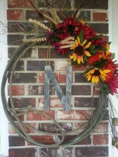 a wreath is hanging on the brick wall