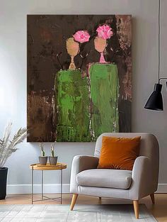 a living room with a chair and painting on the wall