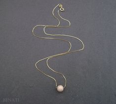 "New and exclusive to Benati. A very elegant round bead necklace, floating gracefully on a dainty solid 14k gold chain. Crafted to perfection in 14k solid gold. The pendant is hanged on a elegant, delicate and dainty gold 'box' approx. 0.6mm chain. if you wish for a thicker chain approx. 0.8mm chain, you can choose so at the checkout process. The pictures are of the approx. 0.6mm gold chain. You or your friend will look super fine with this new exclusive design - by Benati. The size of the round Elegant Gold Chain Jewelry With Round Beads, Yellow Gold Necklaces With Round Beads, Elegant 14k Yellow Gold Beaded Necklace, Elegant Yellow Gold Beaded Necklace, Minimalist Gold Beaded Necklace For Wedding, Gold Pendant Necklace With Tiny Beads, Elegant Pendant Necklace With Tiny Beads, Minimalist Gold Necklace With Ball Chain, Delicate Gold Beaded Necklace With Round Beads