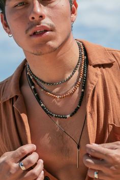 Classic black lava bead necklace with silver accents. Designed to be gender inclusive, this lava necklace is a Hawaii staple. Choose your length for the perfect fit.Bryson is wearing the 24 inch Length.✦ DETAILS ✦✧ Name: Kalama (ee-KIE-kah) - man of strength.✧ 8mm black lava beads.✧ Sterling Silver Hook and Eye Clasp.✧ Silver plated base metal accents.✧ All Ke Aloha Jewelry pieces come packaged thoughtfully, beautifully, and ready for gift giving.✧ Unless otherwise noted in the listing descripti Dream Photoshoot, Hawaii Necklace, Long Leather Necklace, Beach Mood, Hawaiian Necklace, Mens Leather Necklace, Classic Pearl Necklace, Hawaii Jewelry, Black Leather Necklace