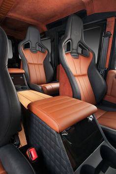 the interior of a vehicle with brown leather seats and black trims, including two matching headrests