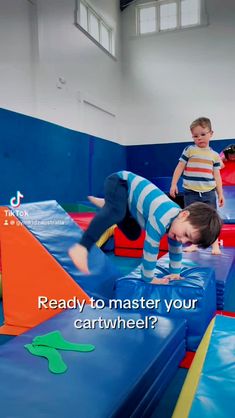 two young boys are playing in an indoor trampoline course with the caption ready to master your cartwheel?