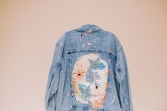 Material: Made with 100% Recycled Cotton. Jacket in washed cotton denim. Collar, buttons at front, and yoke front and back. Chest pockets with flap and button, front pockets, and button at cuffs. Unlined. Description: Light blue denim wash Painted with a colorful abstract design, spreading across the back of the jacket, with splatters of SPLATS, CRACKLES and POPS of surprising color combinations! Signed by SYD. Due to each piece being hand painted, each jacket is one-of-a-kind with its own unique markings and beauty marks. Subtle differences in each. Made with love and made to order, please allow 1-2 weeks delivery, as each jacket is hand painted by Sydney. Limited edition. EACH PIECE IS MADE WITH LOVE AND MADE TO ORDER, HAND PAINTED BY SYDN IN HER WILMINGTON, NC STUDIO Size/Fit: Oversized Denim Collar, Beauty Marks, Beauty Mark, Wilmington Nc, L And Light, Light Blue Denim, Colorful Abstract, Boyfriend Fit, Cotton Jacket