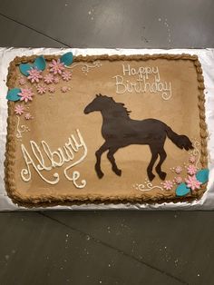 a birthday cake with a horse on it