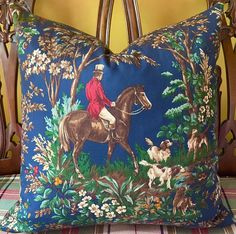 a decorative pillow with a man on a horse