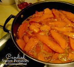 carrots are cooked in a pan on top of the stovetop and ready to be eaten