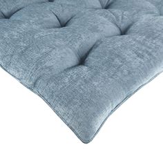 a blue mattress with buttons on it