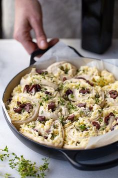 a pan filled with food sitting on top of a table