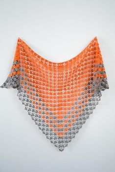 an orange and grey triangle shaped shawl