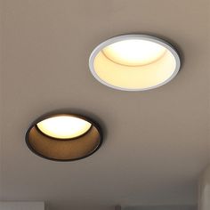 two circular lights are on the ceiling in this room