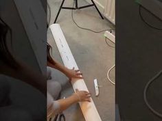 two images show the same person working on a piece of furniture, and one shows how it's made