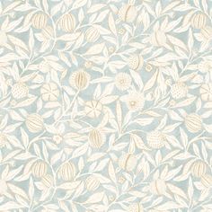 a blue and white wallpaper with leaves and flowers on the back half of it