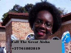 a woman holding up a sign with the words call the great aisha on it