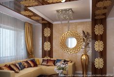 the living room is decorated in gold and brown tones with decorative wall paper on the walls