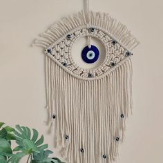 a wall hanging with an evil eye on it