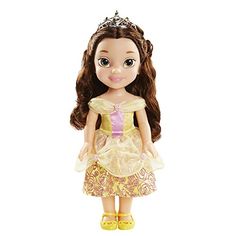 a doll with long hair wearing a tiara and yellow shoes, standing in front of a white background