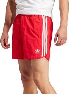 Fit & Design Regular fit track shorts Split side hem offers unrestricted movement Drawcord on elastic waist Fabric has a lightweight, comfortable feel Two side zip pockets and one back pocket Design inspired by the adidas® archives Iconic 3-Stripes down the side Embroidered Trefoil on left thigh Additional Details Made with 100% recycled materials Adidas Summer Activewear With Built-in Shorts, Adidas Activewear With Built-in Shorts For Summer, Summer Sports Shorts With Three Stripes, Summer Sportswear Shorts With Three Stripes, Sporty Summer Shorts With Three Stripes, Summer Sportswear Bottoms With Three Stripes, Summer Workout Activewear With Three Stripes, Adidas Sports Nylon Shorts, Adidas Nylon Sports Shorts