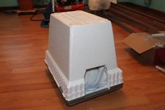 a white object sitting on top of a hard wood floor