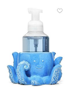 an octopus shaped soap dispenser with a bottle