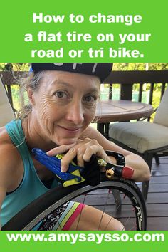 a woman sitting on a bench with her bike in front of her and the words how to change a flat tire on your road or tribike