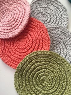 four different colors of yarn sitting on top of each other