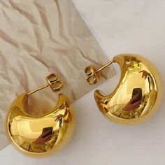 Looking for a striking accessory that will elevate your style? These Polished Gold Plated Metal Hammered Hoop Earrings will do just that! Made with high-quality metal these hoop earrings feature a chic geometric design that's perfect for any occasion - whether it's a party, anniversary, date night, or vacation. And not only are they a great gift for brides, friends, and family, but they also make a stunning addition to any girlfriend's jewelry collection. Don't settle for ordinary earrings - mak Semi-circle Metal Hoop Earrings, Metal Semi-circle Hoop Earrings For Pierced Ears, Semi-circle Metal Hoop Earrings For Pierced Ears, Metal Semi-circle Hoop Earrings, Trendy Crescent Earrings For Pierced Ears, Trendy Gold Crescent Earrings, Girlfriend Jewelry, Blue Floral Print Dress, Wholesale Earrings