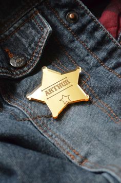 a gold lapel badge with the word africa on it