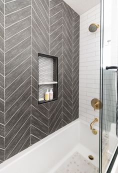 a white bath tub sitting next to a walk in shower