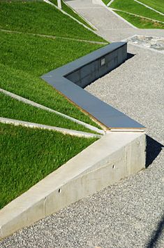 a skateboarder is doing a trick in the air over some concrete steps and grass