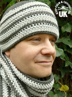 a close up of a person wearing a knitted hat and scarf