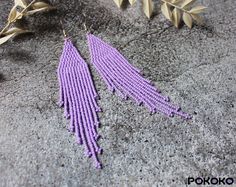 These light purple beaded earrings pair amazingly with any outfit, dressy or casual. They will emphasize your individuality and compliment your personality on various occasions. Perfect for looking pulled together and on trend. They are made of high-quality Czech colored beads with sterling silver hooks and silicone plugs. Colors: light purple. Length: 4.5 inches (11.5 cm) Width: 1 inches (2.5 cm) Materials:     Czech "Preciosa" beads     Durable synthetic thread     Sterling silver ear hooks Elegant Handmade Lavender Beaded Earrings, Elegant Lavender Beaded Drop Earrings, Elegant Purple Summer Jewelry, Elegant Purple Jewelry For Summer, Elegant Summer Purple Jewelry, Elegant Purple Beaded Earrings With Colorful Beads, Elegant Lavender Beaded Earrings, Elegant Lavender Beaded Earrings With Dangling Beads, Spring Bohemian Purple Jewelry