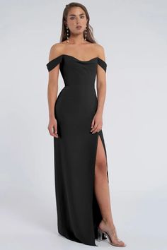 a woman wearing a black dress with an off the shoulder slit