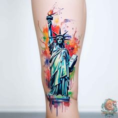 the statue of liberty tattoo is painted with watercolors