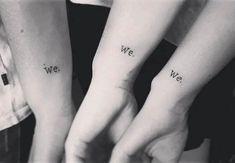 two people holding hands with the words we and we tattooed on their wrists in black ink