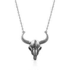 The Buffalo Skull Pendant Necklace is a bold accessory to add to any look. The sculpted pendant has a bright silver finish and depicts a buffalo skull in brilliant detail. The ends of the horns secure the pendant to a 21 inch silver tone adjustable chain to create the necklace. This piece adds a Southwest feel to any look! Montana Silversmiths necklaces are coated in Montana Armor to prevent tarnish. This necklace has a lobster clasp for ease of use. Feature a classic western motif with this sim Buffalo Skull, Skull Pendant Necklace, Bold Accessories, The Buffalo, Tractor Supply, Skull Necklace, Skull Pendant, Accessories Jewelry Necklace, Pendant Design