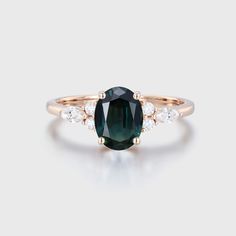 an oval cut green tourmaline and diamond ring