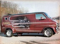 an old red van is parked on the side of the road