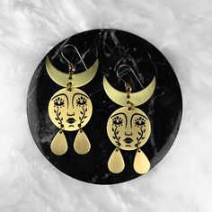 Horned Mother Moon Earrings - While Odin Sleeps Artistic Gold Nickel-free Earrings, Gold Crescent Brass Earrings, Gold Hypoallergenic Festival Earrings, Symbolic Gold Earrings For Festivals, Artistic Gold Brass Earrings, Hypoallergenic Bronze Brass Earrings, Symbolic Brass Earrings With Ear Wire, Gold Crescent Earrings For Festival, Artistic Brass Earrings Nickel Free