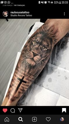 a man's arm with a lion tattoo on it and the words in latin