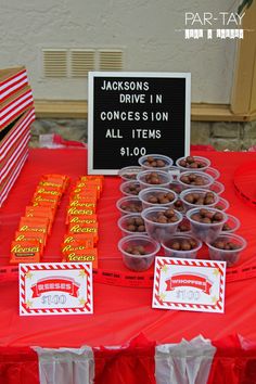 a table topped with lots of desserts and candy