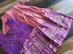 This Lehenga suits 6 yr - 7 yr. Kindly please contact us if needed measurements before purchase. Pink Raw Silk Sets For Navratri, Navratri Fitted Set With Cutdana Details, Anarkali Purple Raw Silk Set, Pink Raw Silk Sets For Diwali, Purple Anarkali Set In Raw Silk, Pink Raw Silk Diwali Sets, Purple Anarkali Raw Silk Set, Fitted Cotton Silk Lehenga In Traditional Drape, Fitted Cutdana Sets For Diwali