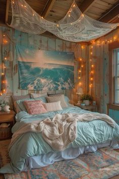 a bed in a room with lights hanging from the ceiling and a painting on the wall