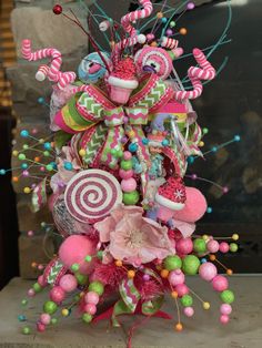 a pink and green christmas tree with candy decorations