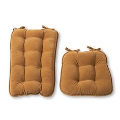 two brown cushions sitting next to each other