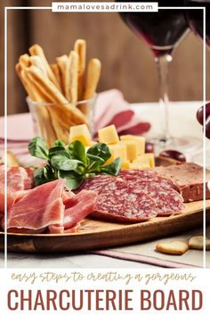 an image of charcuterie board with cheese and meats on it for wine tasting